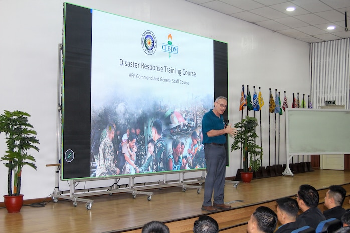 Mike Wylie, Disaster Management and Humanitarian Assistance Advisor for the U.S. Pacific Command’s Center for Excellence in Disaster Management and Humanitarian Assistance (CFE-DM), provides opening remarks for a CFE-DM-led Disaster Response training course to 204 students of Class 77, Command and General Staff College, Armed Forces of the Philippines, at Camp Aguinaldo, Philippines 4 August.