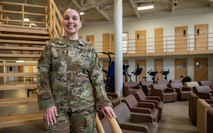Female Airman standing on stairs.
