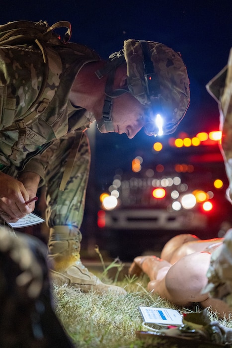 An Airman provides aid to a simulated casualty.