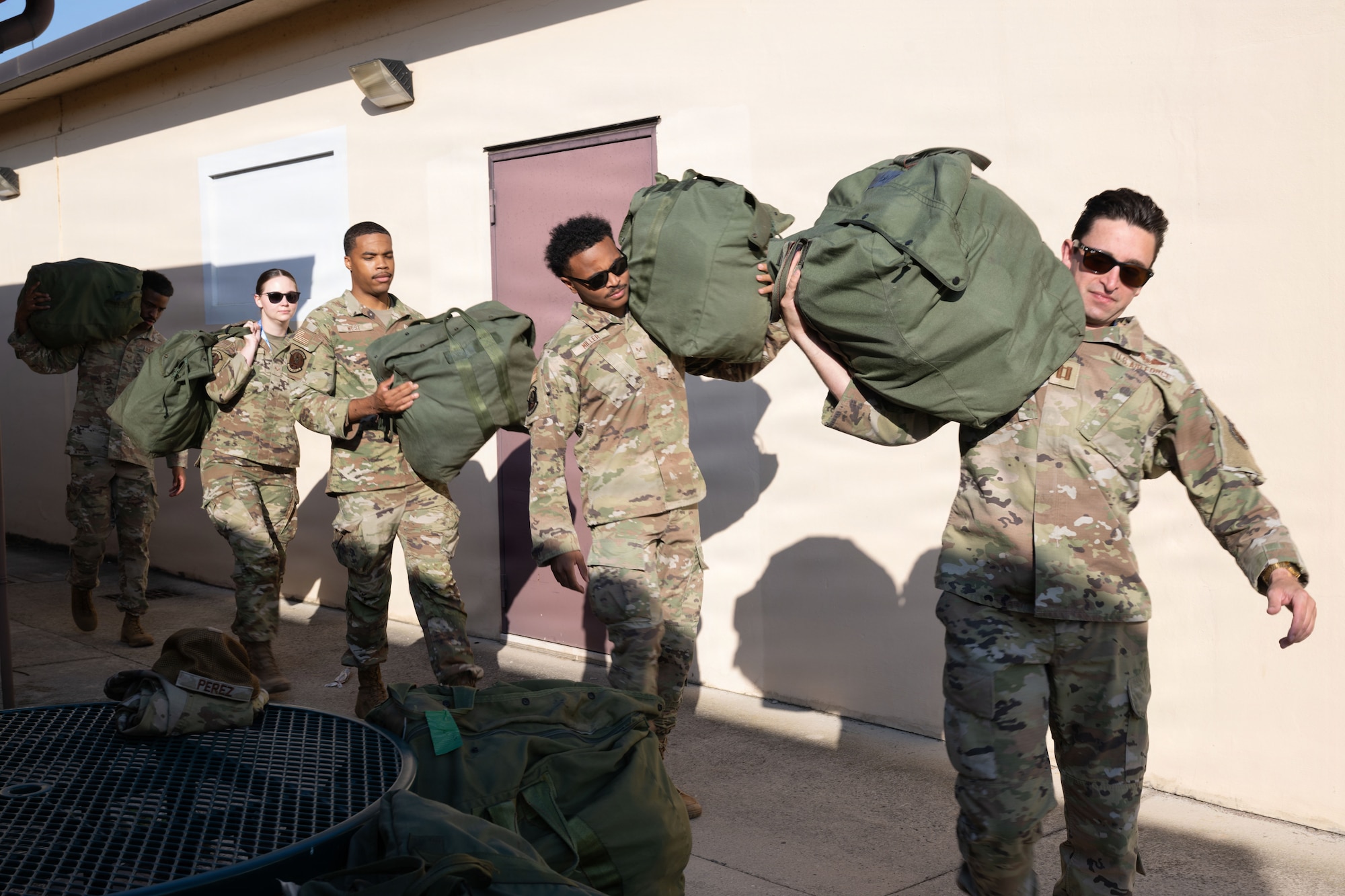 Airmen move equipment in preparation for an exercise.