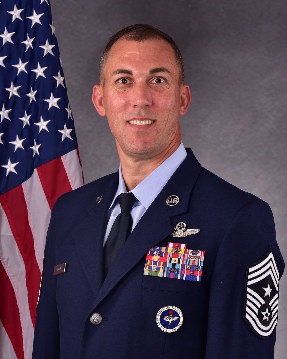 man in uniform poses for official photo