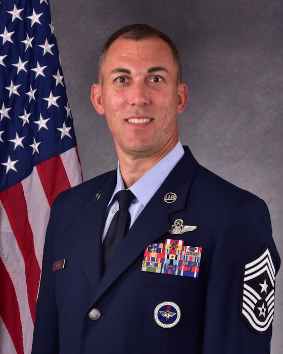 man in uniform poses for official photo