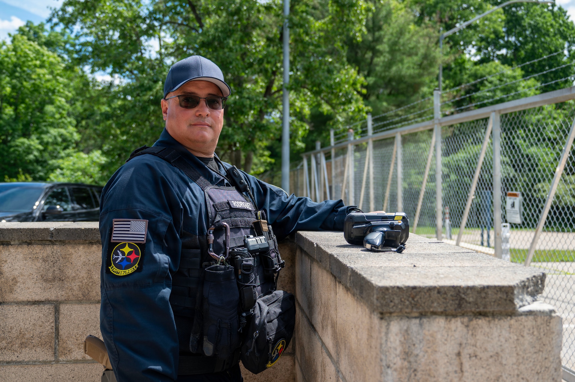 Ruben Rodriguez, officer in charge at the 171st Air Refueling Wing entry control point, poses for a portrait at his post, June 16, 2026, near Pittsburgh, Pennsylvania. Rodriguez served 30 years in the armed forces and retired as a command sergeant major from the New Jersey Army National Guard in 2017. (U.S. Air National Guard photo by Airman 1st Class Natalie Claypoole)