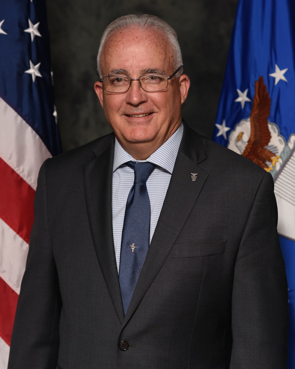 A professional bio photo of an executive.