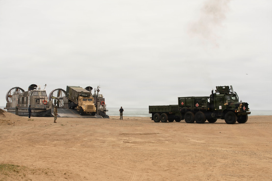 U.S. Marines assigned to 15th Marine Expeditionary Unit, offload personnel and equipment from U.S. Navy Landing Craft, Air Cushion (LCAC) 57 attached to Assault Craft Unit 5 during an in-stream offload at Marine Corps Base Camp Pendleton, Aug. 13, 2026.