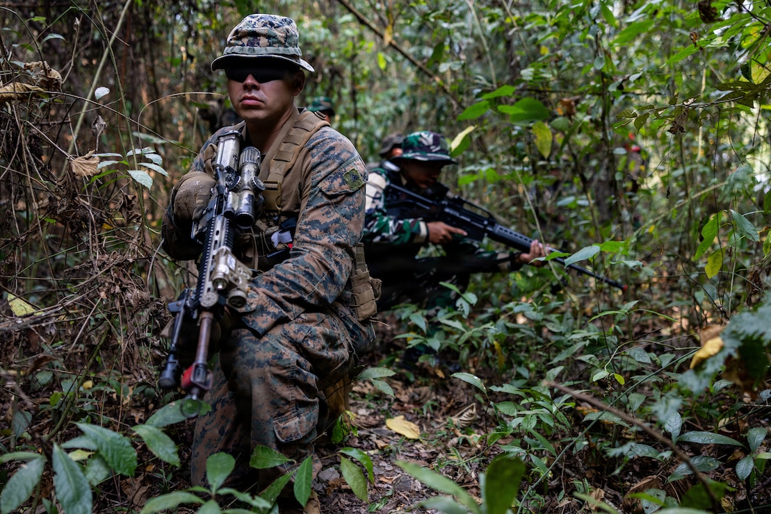 U.S. Marine Corps Cpl. Trent Ai, a team leader with Alpha Company, 1st Battalion, 5th Marine Regiment, Marine Rotational Force – Darwin 26, provides security during a point man course as part of a platoon exchange near Lampung, Indonesia, Aug. 18, 2026.