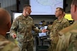 U.S. Army Lt. Gen. Allan M. Pepin, United States Army North’s commanding general, speaks to Maj. Miles Miller, the project officer with Task Force 46, and other distinguished leaders from the 63rd Theater Aviation Brigade during Vibrant Response 2026 at Camp Atterbury, Indiana, Apr. 24, 2026. Pepin was there to oversee VR-26, which is a large-scale U.S. military exercise designed to prepare forces to respond to chemical, biological, radiological, and nuclear (CBRN) incidents within the homeland held April 13-29, 2026. (U.S. Army National Guard photo by Sgt. 1st Class Benjamin Crane)