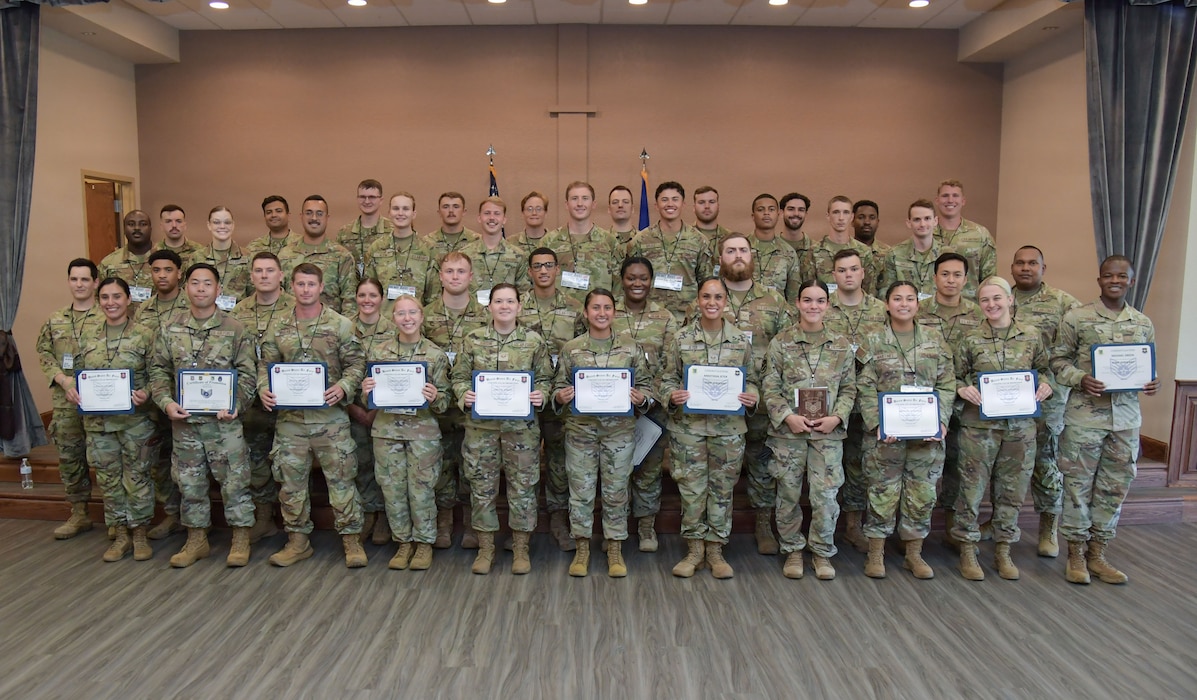 A group of U.S. Airmen pose for a group photo.