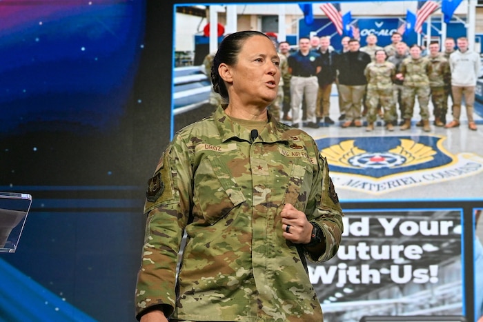Woman speaking on stage