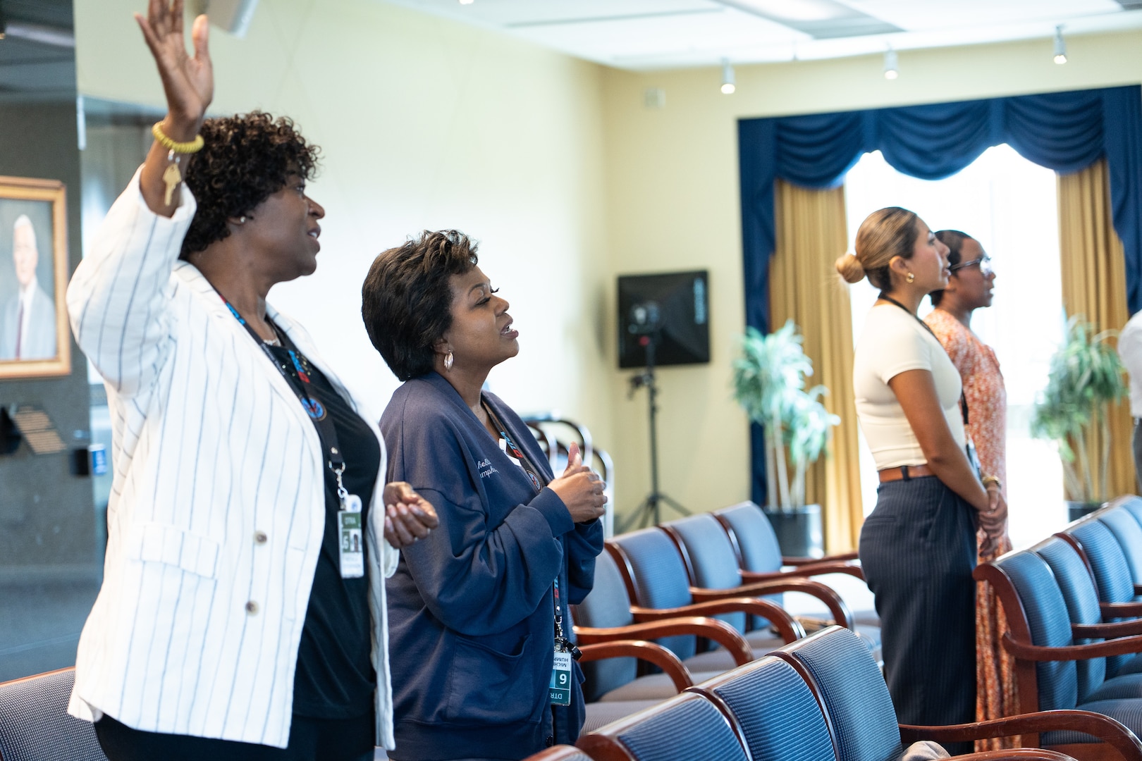 Four women enjoy worship.