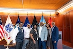 Six people pose for a photo.