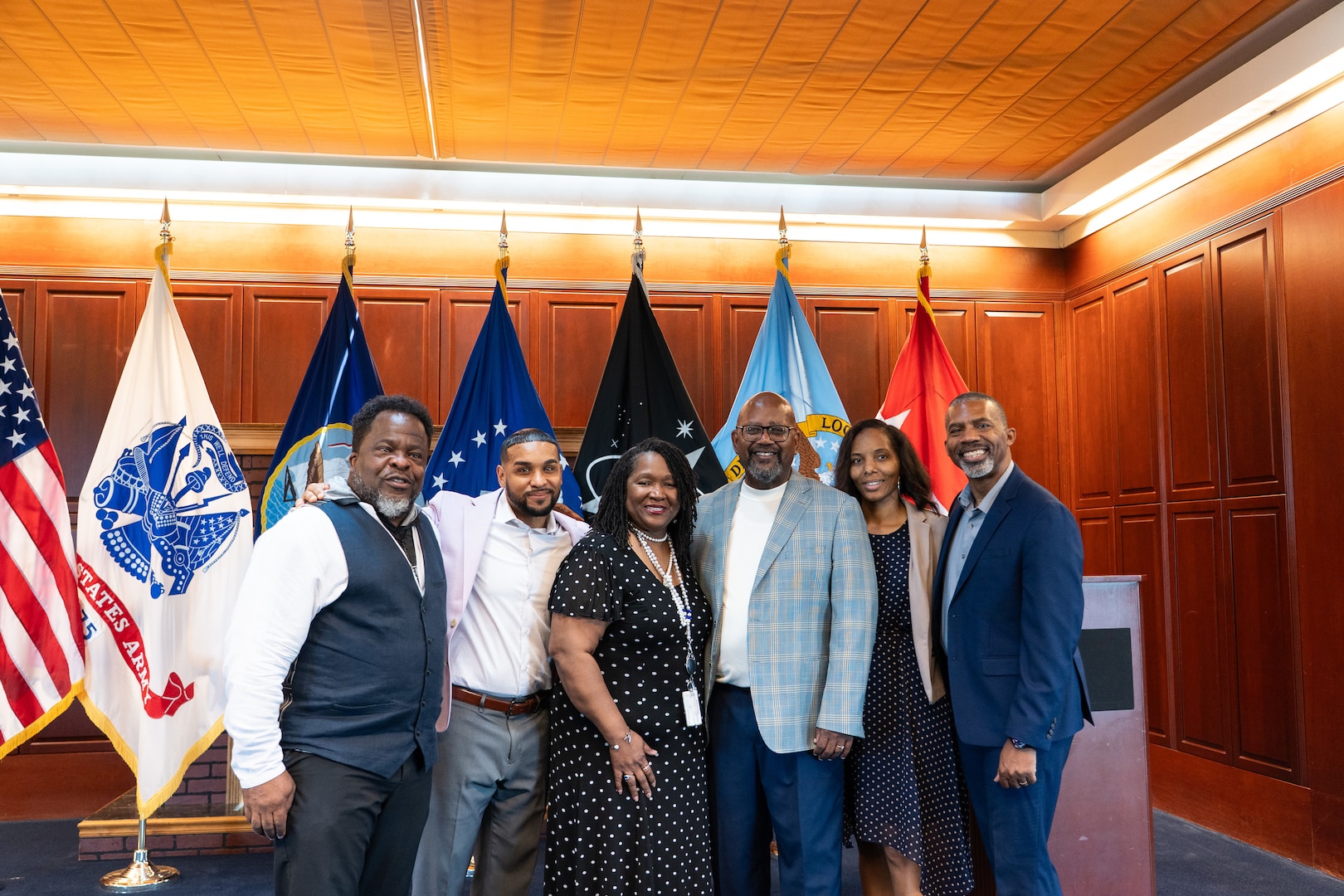 Six people pose for a photo.