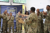 Illinois Army National Guard recruiters assigned to Foxtrot Company, Recruiting and Retention Battalion, Illinois Army National Guard, celebrate an outstanding career during the retirement ceremony for Sgt. 1st Class David Quinn