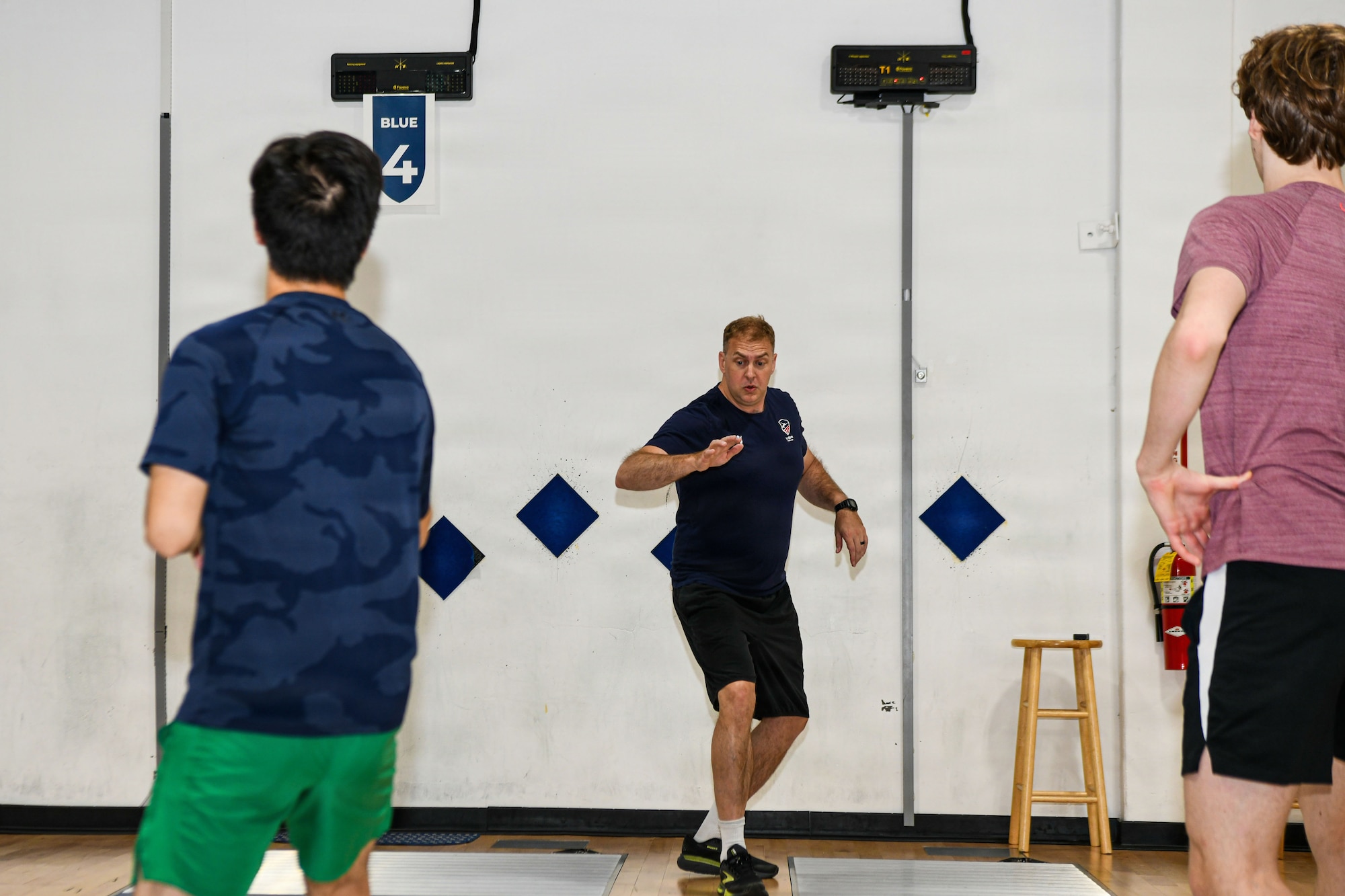 Lt. Col. Weston "Seth" Kelsey coaches fencing team