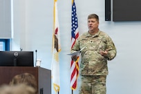 Lt. Col. Aaron A. Hepner delivers remarks following the pinning of his new lieutenant colonel rank during his promotion ceremony