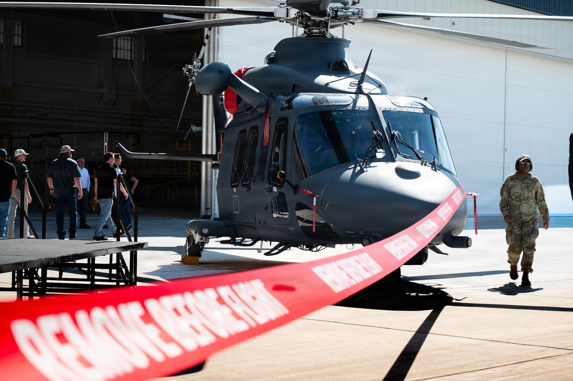 A grey wolf is on display in front of the 37th Helicopter and 90 MSOS TRF Building