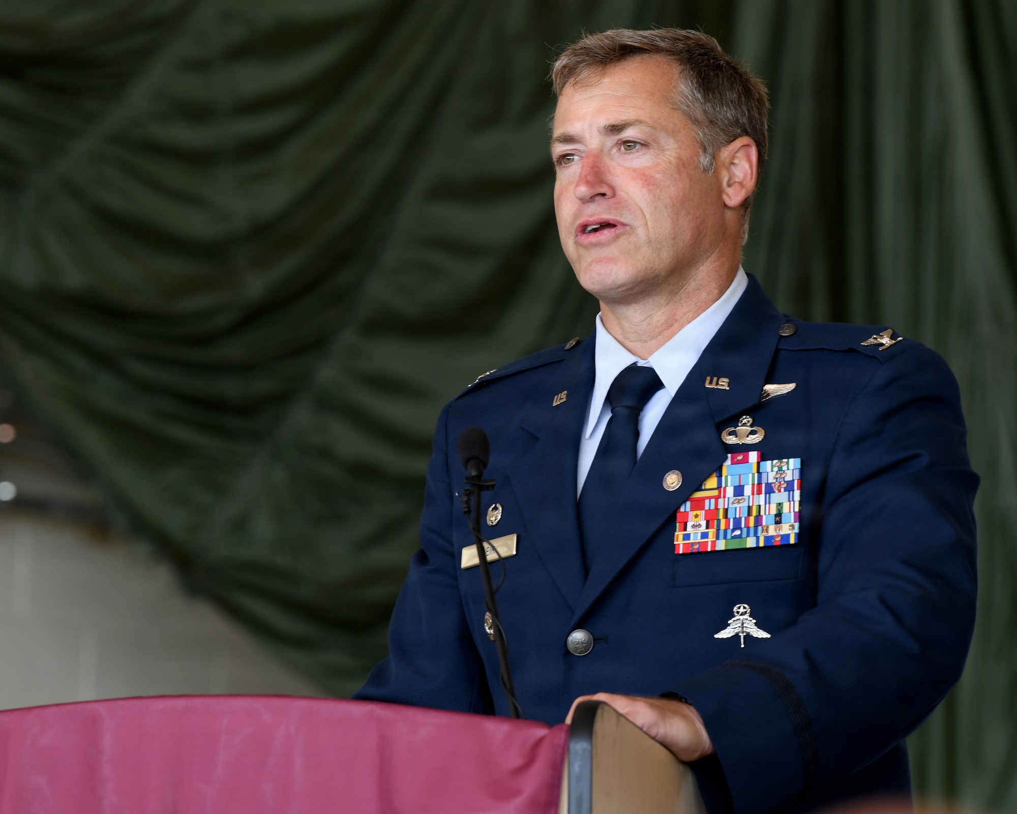 U.S. Air Force Col. Glyn B. Weir, assigned to the New York Air National Guard, speaks during his retirement ceremony at Francis S. Gabreski Air National Guard Base, Westhampton Beach, New York, June 6, 2026. Weir retired after 34 years of military service, including more than two decades with the 106th Rescue Wing. (U.S. Air National Guard photo by Tech. Sgt. Kevin Donaldson)