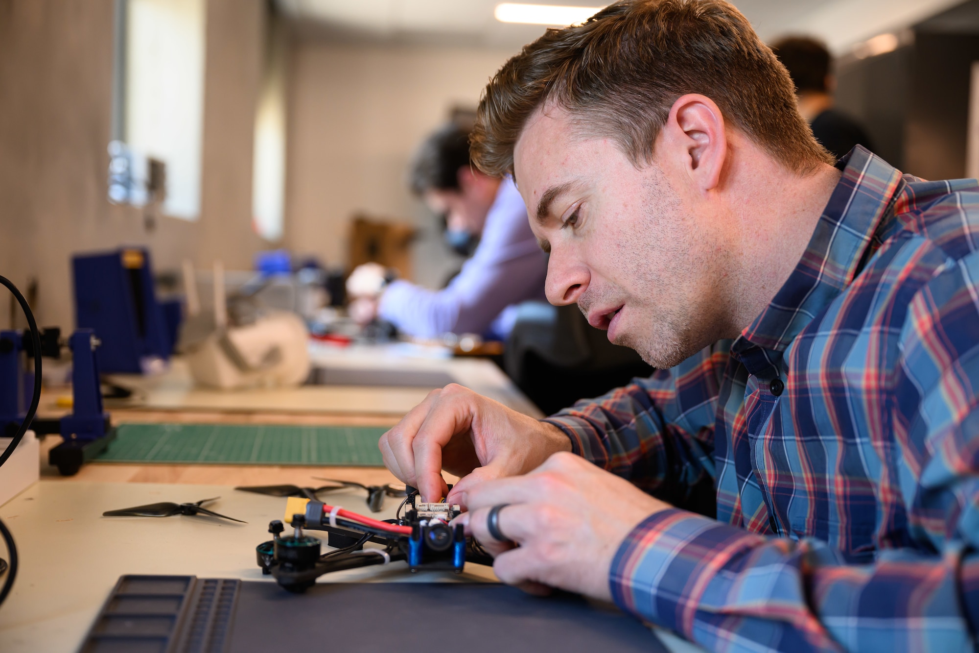 Steven Turner, 309th Software Engineering Group, works on a drone at Hill Air Force Base, Utah, June 20, 2026. Operating out of the 309th Engineering Group's "Launch Pad," the Black Knights team delivers custom, Blue-listed drones for the cost of components and parts. The team also assists with flight training and certification for its customers. (U.S. Air Force photo by R. Nial Bradshaw)