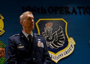 U.S. Air Force Col. Kevin Lawhon, assigned to the New York Air National Guard, 106th Rescue Wing, speaks during his promotion ceremony at Francis S. Gabreski Air National Guard Base, Westhampton Beach, New York, July 31, 2026. Lawhon was promoted to colonel and serves as the 106th Mission Support Group Commander. (U.S. Air National Guard photo by Staff Sgt. Hunter Unis)