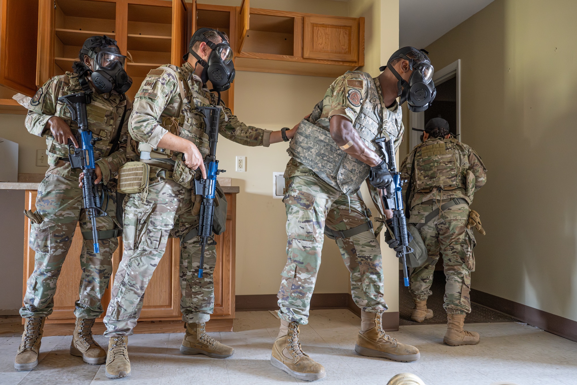 U.S. Airmen clear a room during the Southwest Showdown training event at Dyess Air Force Base, Aug. 12, 2026. Emergency management flights from Dyess, Laughlin, Goodfellow, Tinker and Eglin Air Force Base trained on tactical movement and response procedures during simulated threat conditions. (U.S. Air Force photo by Airman 1st Class Caleb Schellenberg)