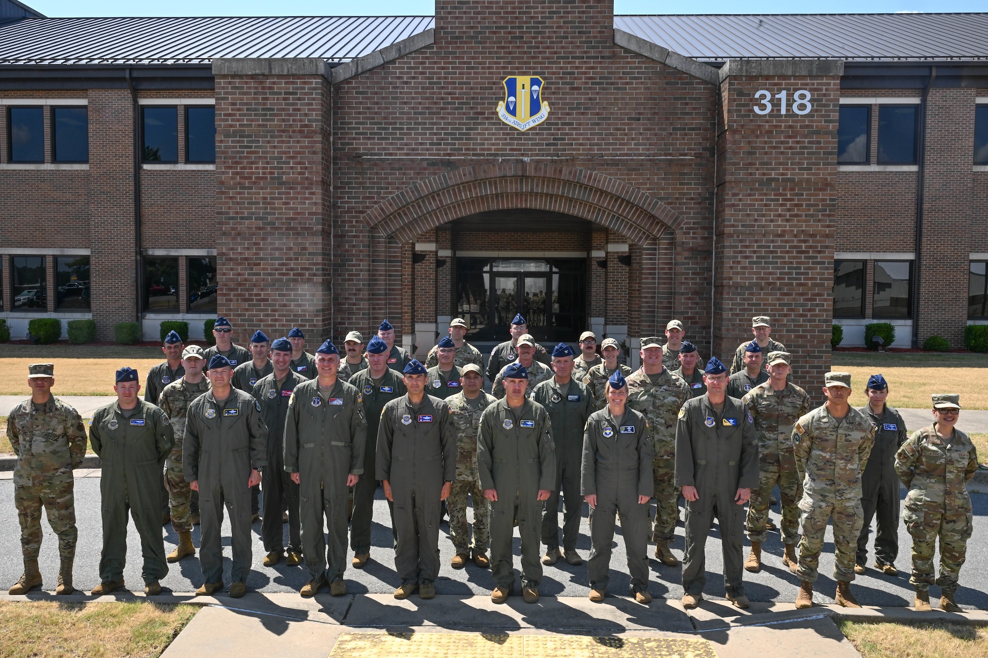 Men stand for a group photo