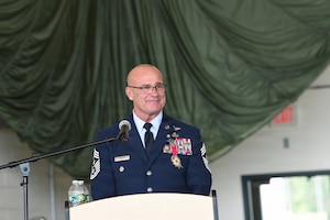 U.S. Air Force Command Chief Master Sgt. Michael T. Hewson, a Pararescueman and the New York Air National Guard's senior enlisted leader, speaks during his retirement ceremony at Francis S. Gabreski Air National Guard Base, Westhampton Beach, New York, Aug. 1, 2026. Hewson retired after 40 years of military service, including more than three decades with the 106th Rescue Wing. (U.S. Air National Guard photo by Tech. Sgt. Kevin Donaldson)