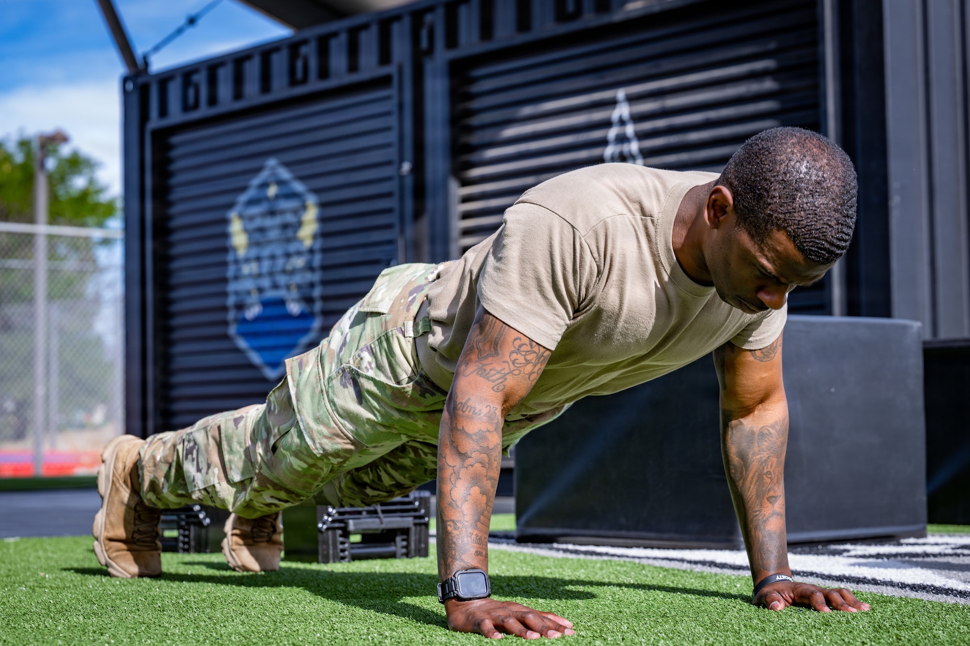 U.S. Air Force Master Sgt. Nicholas Brown, Space Base Delta 1 inspection manager, performs a metronome hand-release pushup