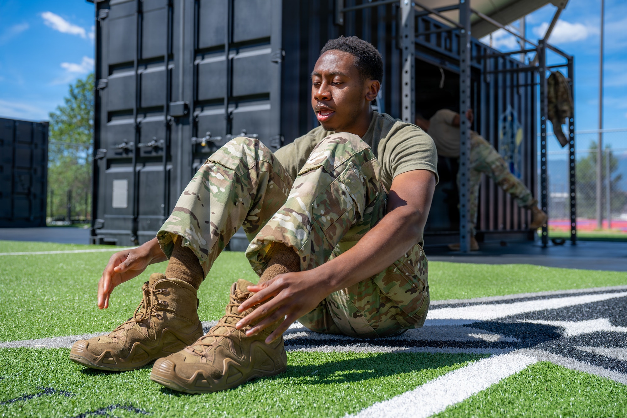 U.S. Air Force Tech. Sgt. John Foster, 21st Security Forces Squadron response force member, performs sit-ups
