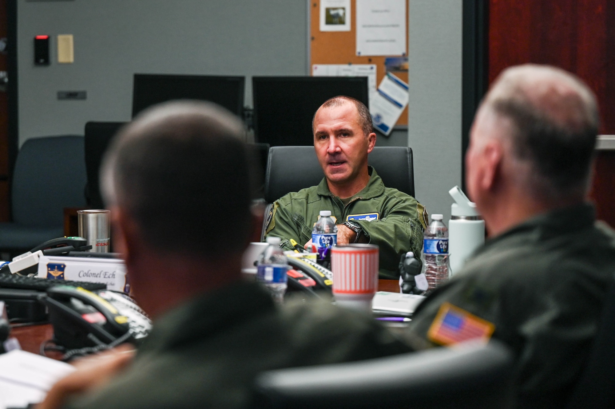 Men sit at a table talking