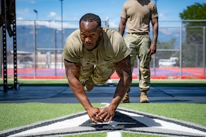 U.S. Air Force Airman 1st Class Jamari Broussard, 21st Security Forces Squadron response force member, performs a hand-release burpee