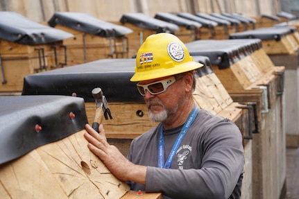 Michael Crabbe-Jones, wood/shipwrights specialist with  Pearl Harbor Naval Shipyard and Intermediate Maintenance Facility (PHNSY & IMF) finalizes the keel blocks in preparation for the docking of a Virginia-class fast-attack submarine at Joint Base Pearl Harbor-Hickam, July 7, 2026.