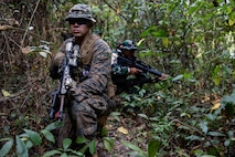 U.S. Marine Corps Cpl. Trent Ai, a team leader with Alpha Company, 1st Battalion, 5th Marine Regiment, Marine Rotational Force – Darwin 26, provides security during a point man course as part of a platoon exchange near Lampung, Indonesia, Aug. 18, 2026.