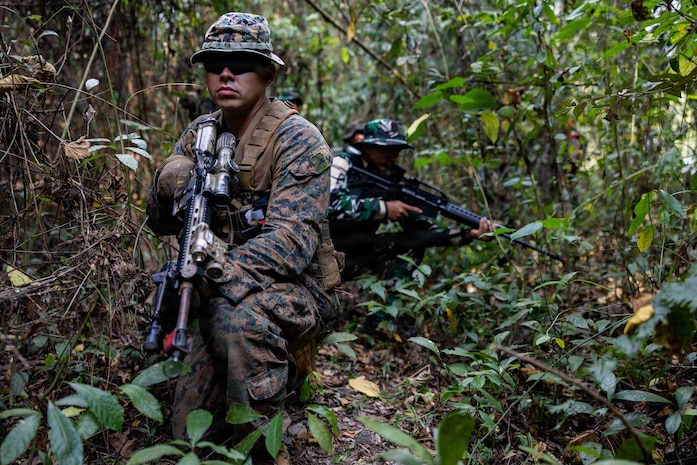U.S. Marine Corps Cpl. Trent Ai, a team leader with Alpha Company, 1st Battalion, 5th Marine Regiment, Marine Rotational Force – Darwin 26, provides security during a point man course as part of a platoon exchange near Lampung, Indonesia, Aug. 18, 2026.