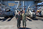 Rear Adm. Marcos Jasso, commander, Carrier Strike Group (CSG) 9, left, poses for a photo with Rear Adm. Chris Cavanaugh, commander, Submarine Force, U.S. Pacific Fleet, during the exercise Rim of the Pacific (RIMPAC), aboard Nimitz-class aircraft carrier USS Theodore Roosevelt (CVN 71), July 30, 2026. Thirty nations, over 30 surface ships, five submarines, 15 national land forces, more than 206 aircraft and 30,000 personnel are participating in RIMPAC in and around the Hawaiian Islands, June 24 to July 31. The world’s largest international maritime exercise, RIMPAC provides a unique training opportunity while fostering and sustaining cooperative relationships among participants critical to ensuring safety of sea lanes and security on the world’s oceans. RIMPAC 2026 is the 30th exercise in the series that began in 1971. (U.S. Navy photo by Mass Communication Specialist 2nd Class Ryan Holloway)