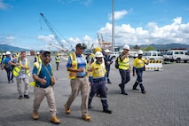 Members of the Papua New Guinea (PNG) National Disaster Centre, PNG Port of Lae, provincial disaster offices, U.S. and international disaster response organizations, government agencies, nongovernmental organizations and international organizations familiarize participants on areas of training during a walkthrough at the Port of Lae, Aug. 10, 2026, Lae, Morobe Province, Papua New Guinea.