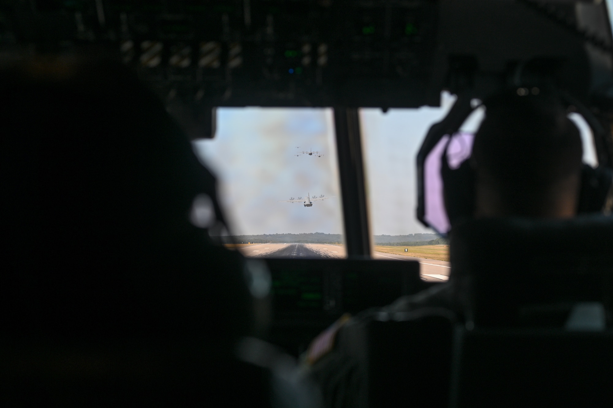 Pilots fly in a plane