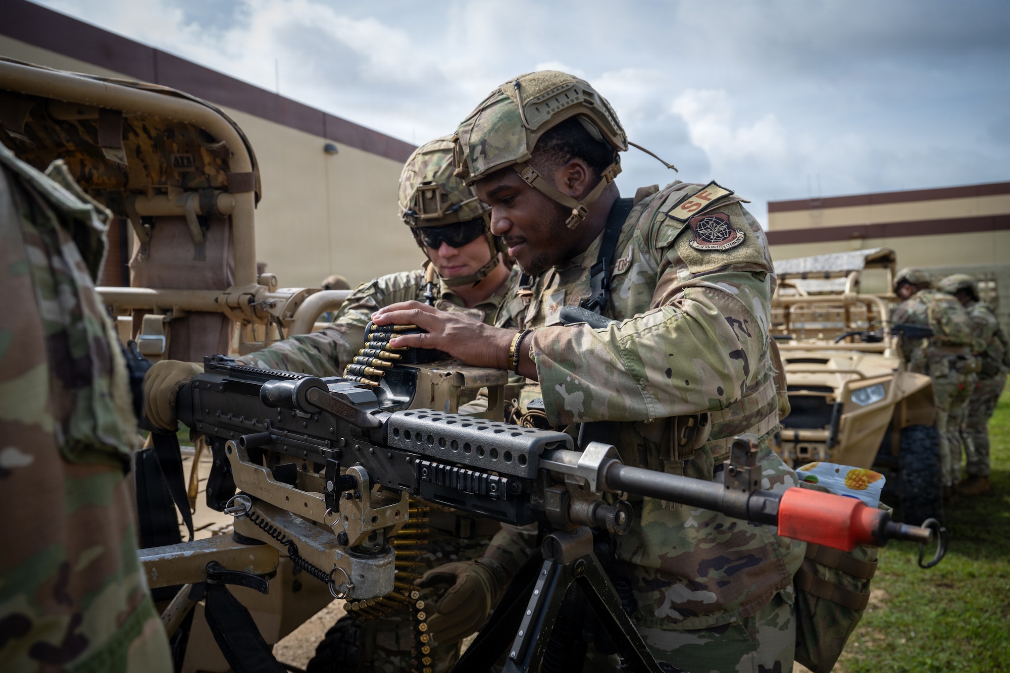 U.S. Air Force security forces Airmen mount an M240B machine gun onto a vehicle during Pacific Defender Sustainment Training 2026 at Northwest Field, Guam, August 5, 2026. The 736th Security Forces Squadron sharpens critical warfighting skills, tactical operations, and regional defense readiness by providing realistic training and combat scenarios. (U.S. Air Force photo by Senior Airman Adrien Tran)