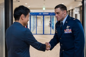 Aomori Prefecture Gov. Sōichirō Miyashita, left, and U.S. Air Force Col. Oliver Lause, 35th Fighter Wing commander, right, shakes hands following an introductory office call in Aomori City, Japan, Aug. 19, 2026.