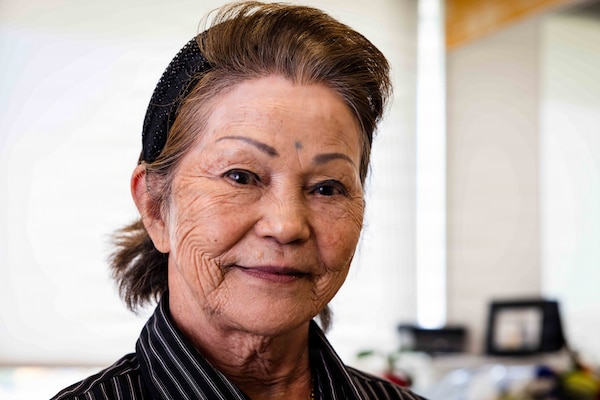 Haru Uchira, U.S. Naval Hospital Okinawa’s (USNHO) barber, poses for a portrait in USNHO’s barber shop at Camp Foster, Okinawa, Japan, Aug. 13, 2026. Uchira retired after 56 years of service, witnessing USNHO’s transition from U.S. Army to U.S. Navy-operated in 1977, multiple organizational redesignations, and its relocation from Camp Lester to Camp Foster in 2013. (U.S. Navy photo by Mass Communication Specialist 1st Class Simon Pike)