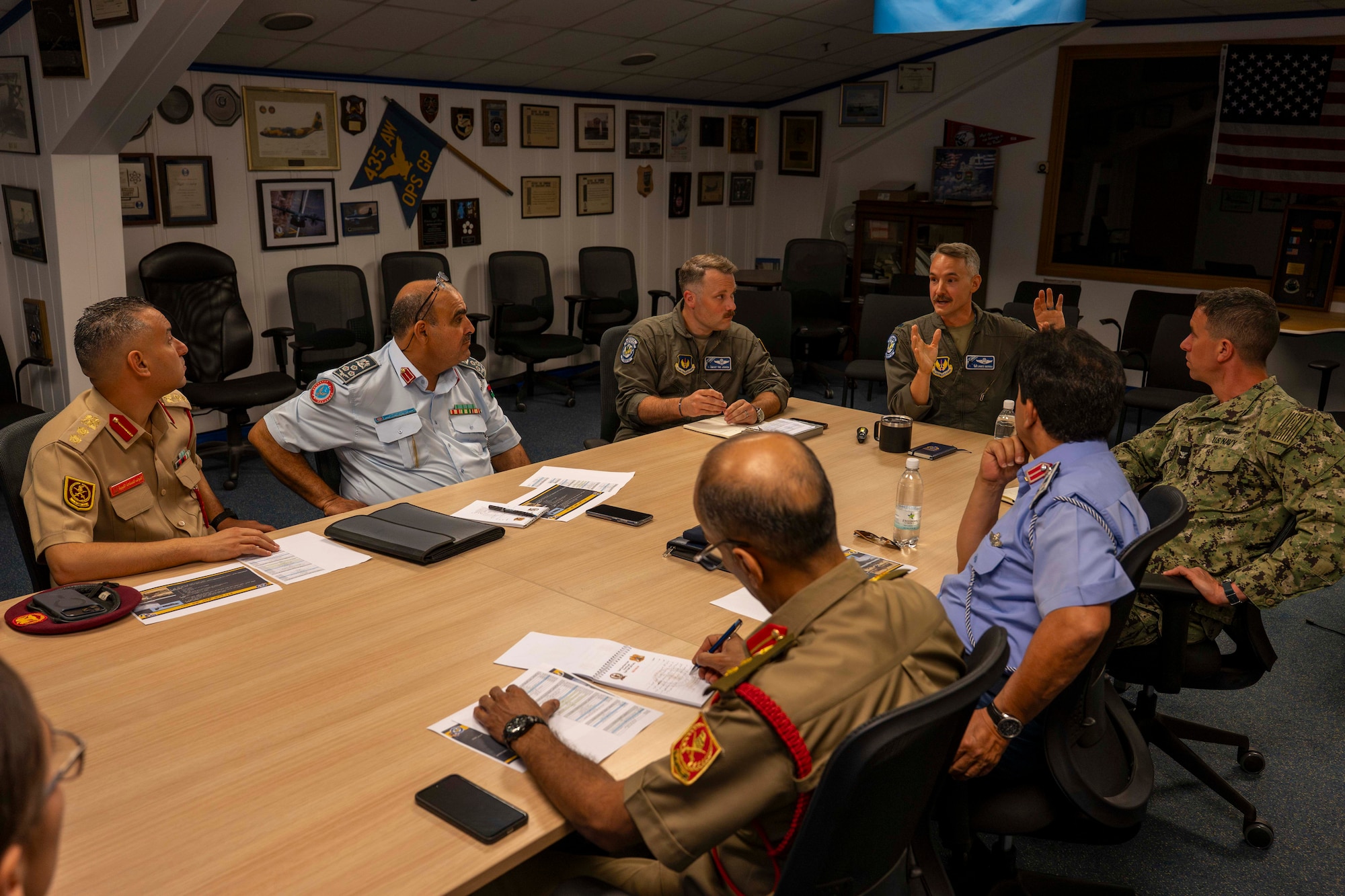 7 men at a conference table