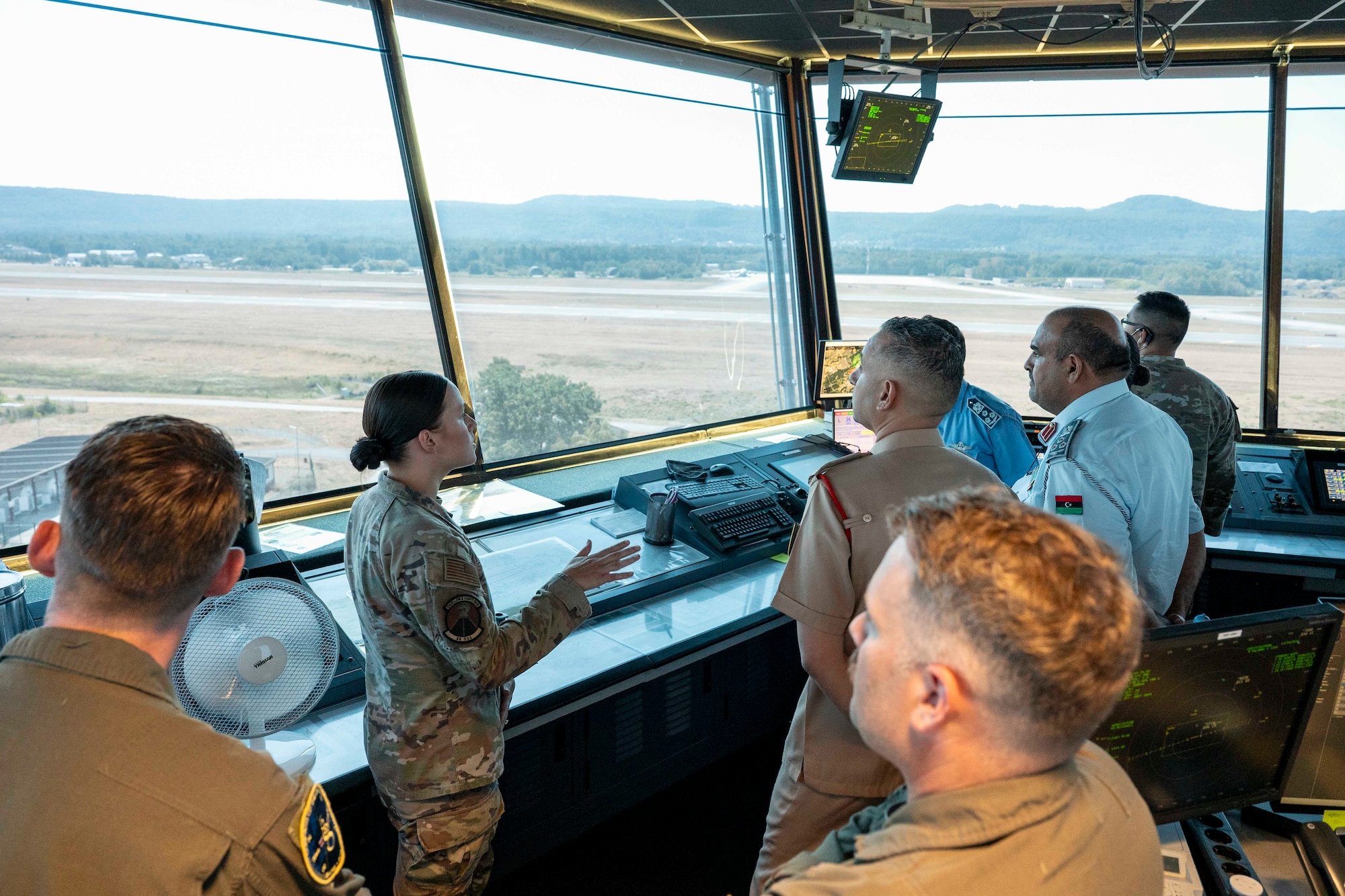 A group of people in an air control tower