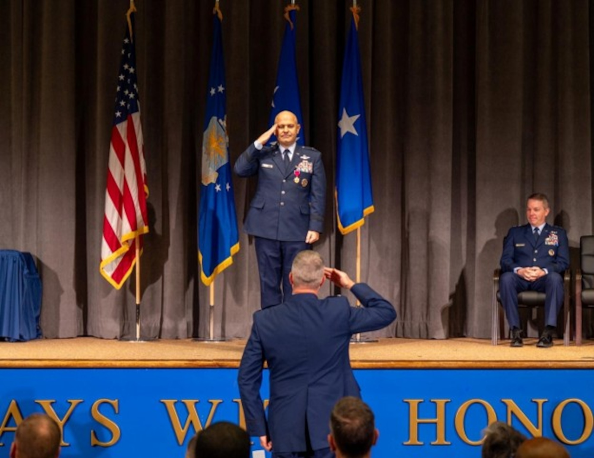U.S. Air Force Brig. Gen. Joseph Sheffield, Jeanne M. Holm Center outgoing commander, renders his final salute to the Holm Center during a change of command ceremony at Officer Training School, Maxwell Air Force Base, Alabama, Aug. 18, 2026. The final salute symbolizes Sheffield’s farewell to the organization he led and marks the formal transition of command and responsibility to his successor. (U.S. Air Force photo by Senior Airman Tanner Doerr)