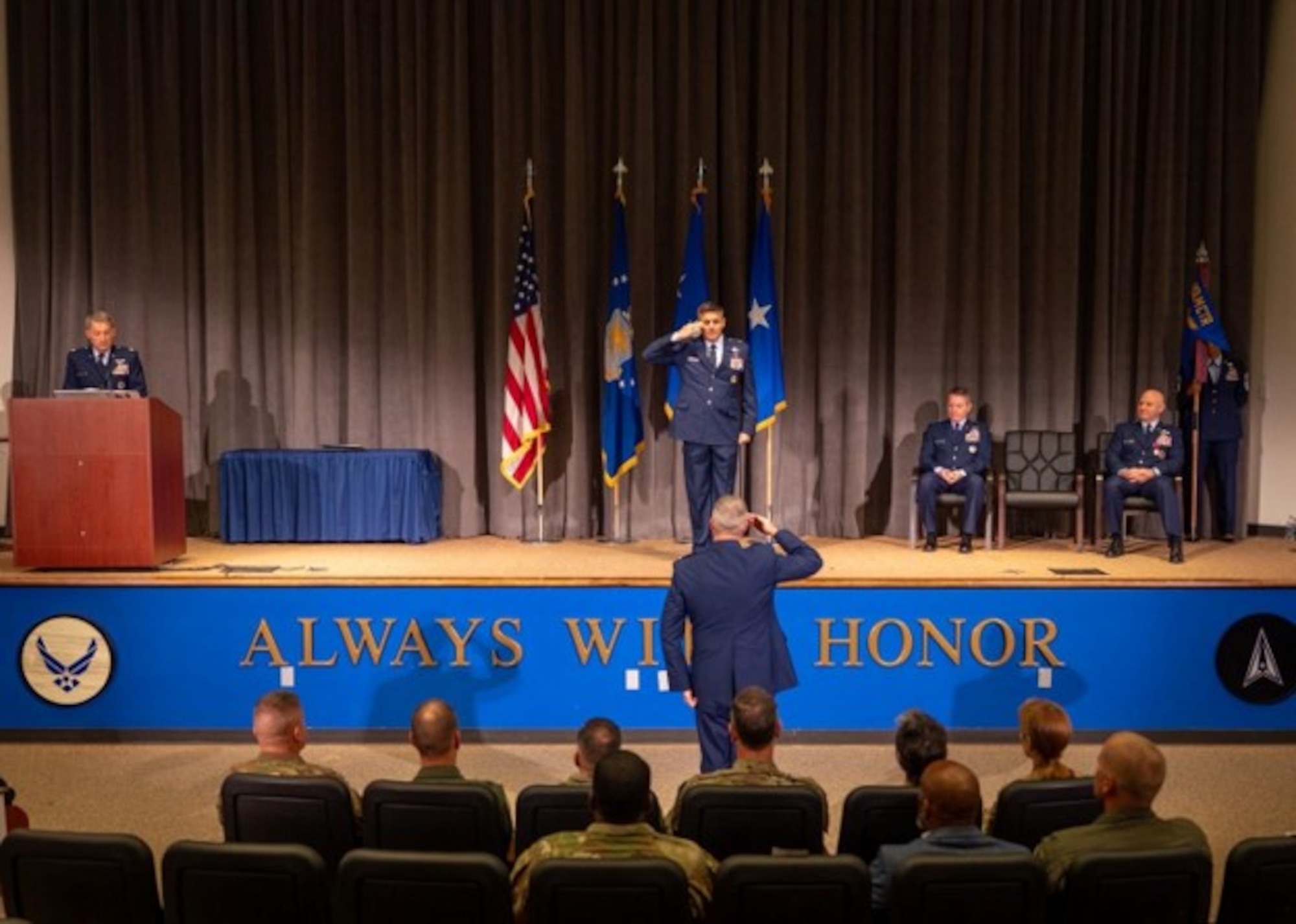 U.S. Air Force Brig. Gen. Christopher Lay, Jeanne M. Holm Center incoming commander, renders his first salute to the Holm Center during a change of command ceremony at Officer Training School, Maxwell Air Force Base, Alabama, Aug. 18, 2026. The first salute symbolizes Lay’s assumption of command and marks the beginning of his leadership of an organization responsible for developing and preparing 85% of officers entering the Department of the Air and Space Force. (U.S. Air Force photo by Senior Airman Tanner Doerr)