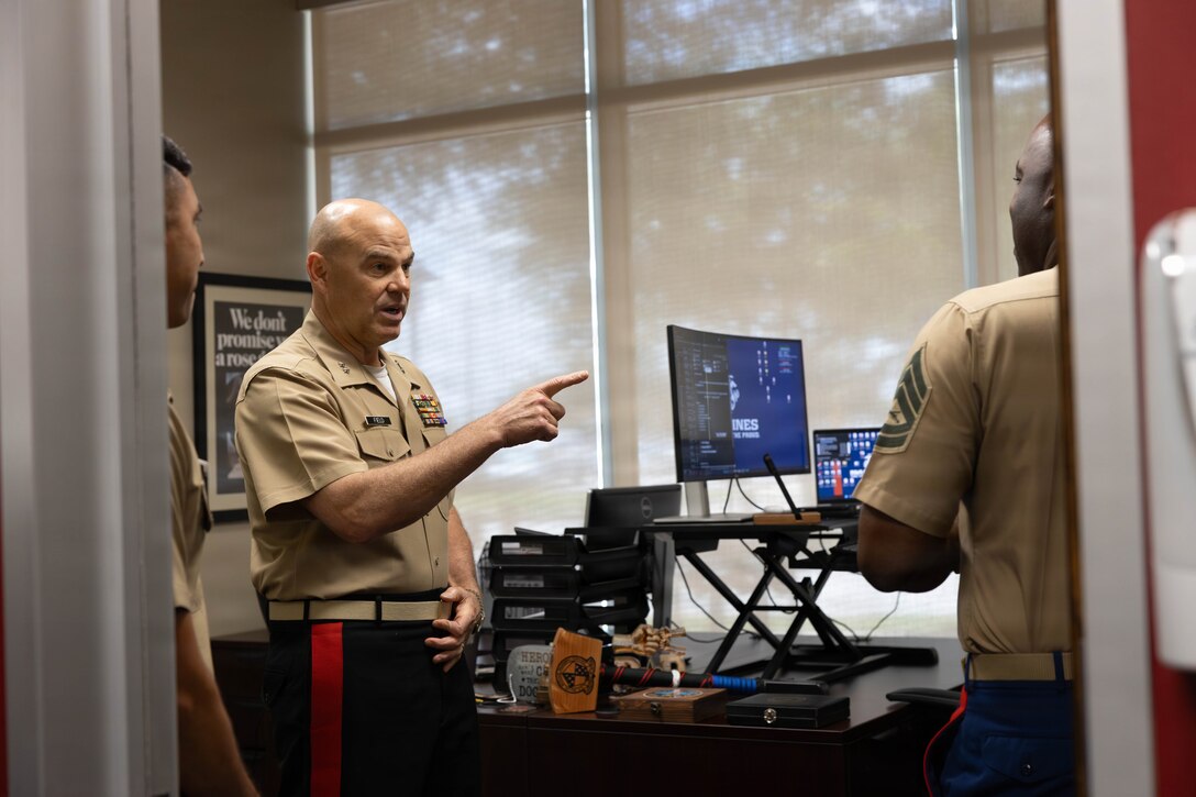 U.S. Marine Corps Maj. Gen. Walker M. Field, commanding general of Marine Corps Recruiting Command, speaks to Marines with Officer Selection Team (OST) Houston during a visit to OST Houston, July 1, 2026. Field met with Marines and personnel to discuss recruiting efforts and recognize their contributions to the officer accession mission. (U.S. Marine Corps photo by Cpl. Christian Salazar)