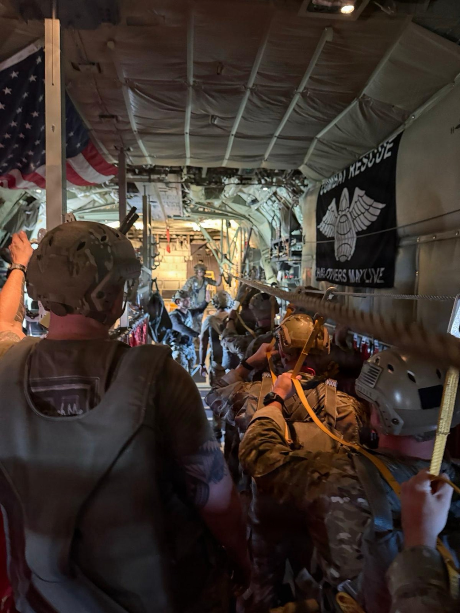 U.S. Army Soldiers assigned to 1st Battalion, 10th Special Forces Group (Airborne), prepares to conduct a static line jump from a U.S. Air Force HC-130J Combat King II aircraft from the 102nd Rescue Squadron, 106th Rescue Wing, over Stuttgart, Germany, on January 13, 2026. This jump was conducted as part of Exercise Silver Arrow, a multinational exercise focused on enhancing interoperability and readiness between partner nations. (Courtesy Photo)
