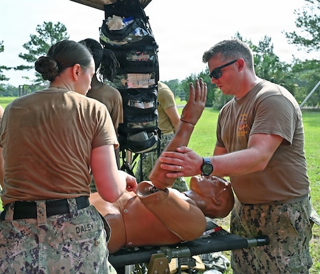 A trauma assessment is performed by Expeditionary Medical Facility 150 Mike Sailors in a field emergency room during the Expeditionary Sustainment training exercise July 31. Sailors remarked they felt better prepared to go downrange after this two-day exercise with their peers. (U.S. Navy photo by Julie M. Lucas)