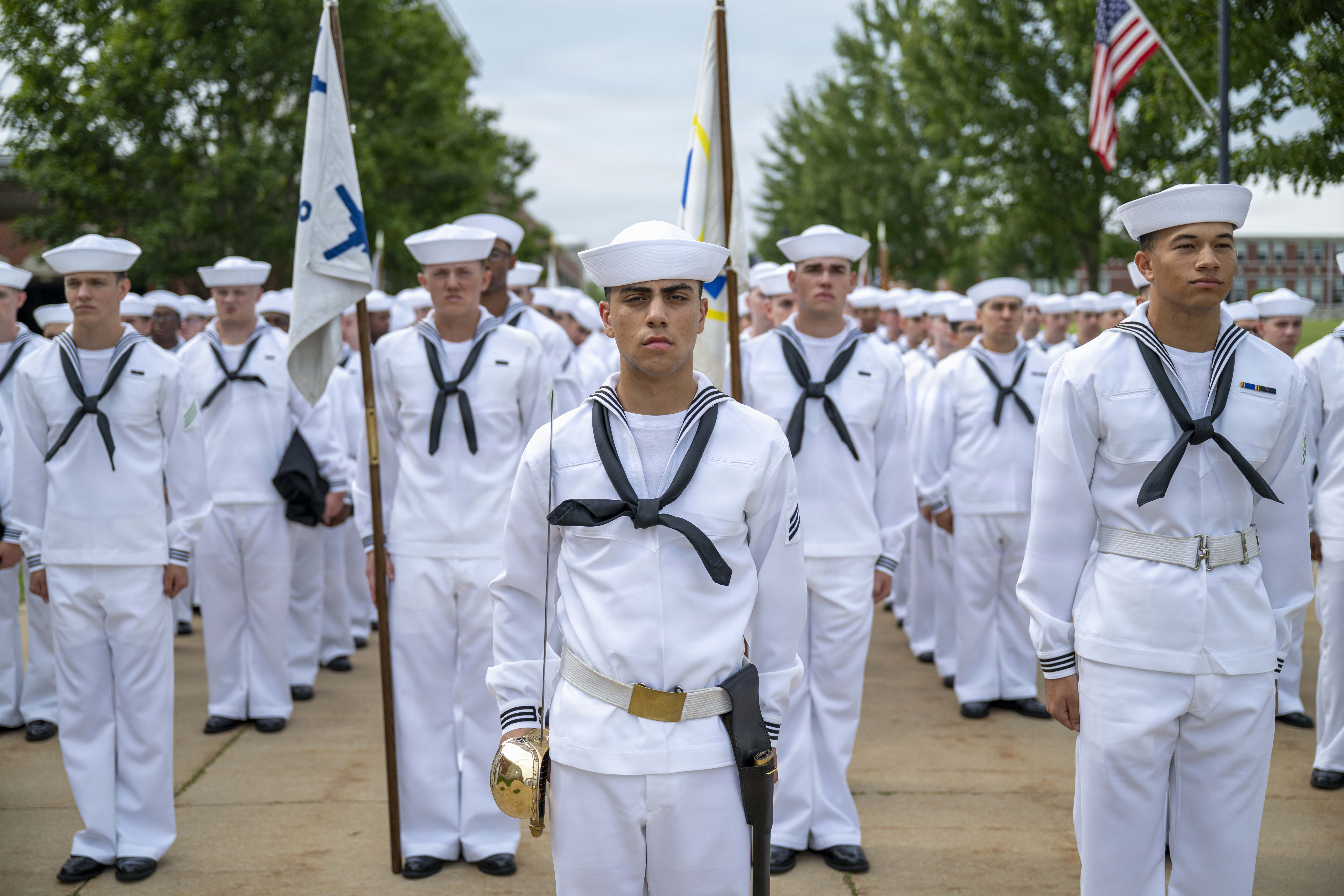 Sailors wait to march into Midway Ceremonial Drill Hall during pass-in-review onboard U.S. Navy Recruit Training Command in Great Lakes, Aug. 6, 2026. Training is approximately nine weeks and all enlistees in the U.S. Navy begin their career at the command. More than 40,000 recruits train annually at the Navy’s only boot camp.