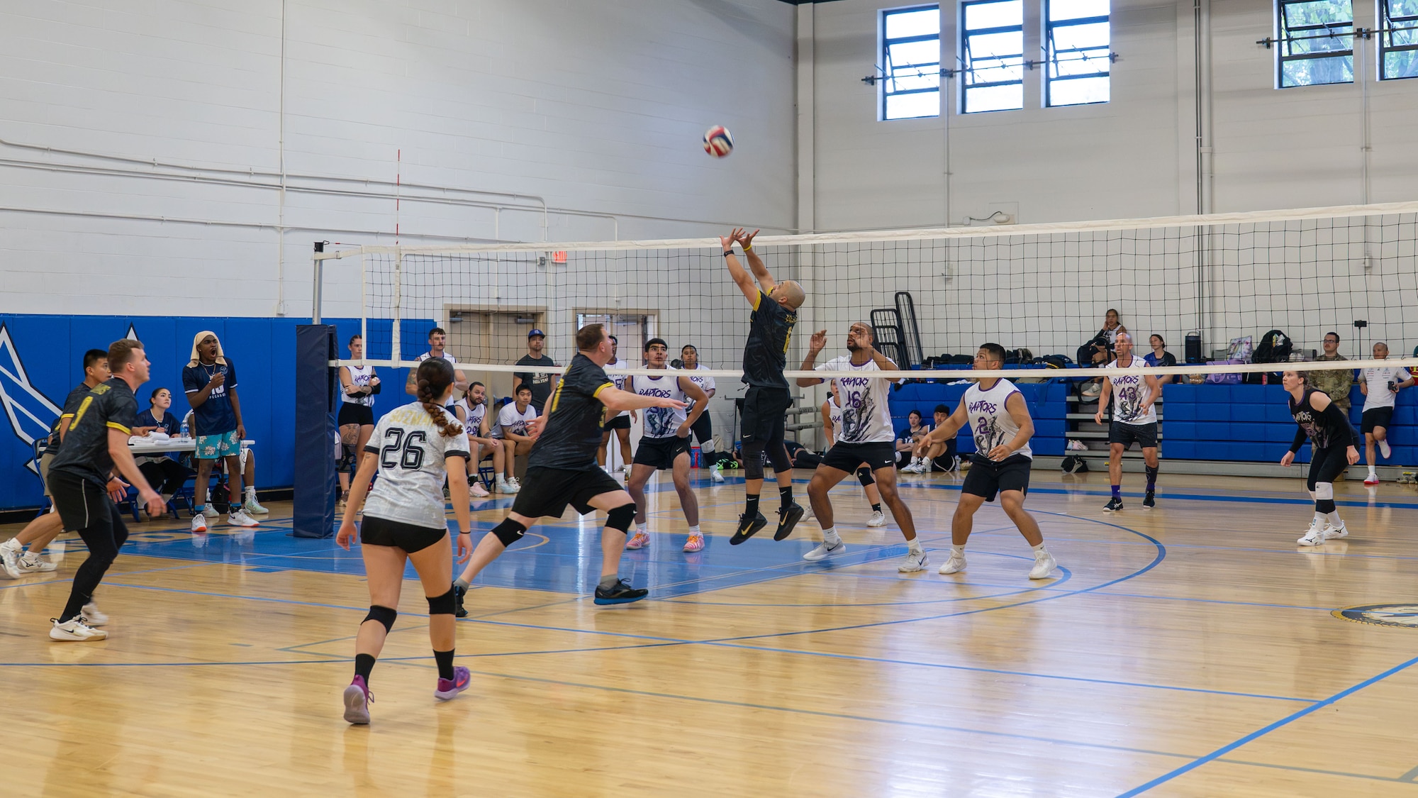 People playing volleyball.