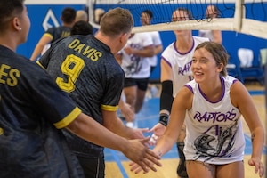 Opposing teams shake hands.