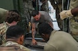 Pennsylvania and Texas Air National Guardsmen assigned to the 111th Attack Wing and the 149th Fighter Wing, work together to set up a Expandable Single Pallet Expeditionary Kitchen (E-SPEK) during a joint training at Biddle Air National Guard Base, Horsham, Pennsylvania, Aug. 17, 2026. The purpose of this training was to complete training required every 24 months, to ensure deployment readiness, and to work together with other wings. (Pennsylvania Air National Guard photo by Staff Sgt. Charles Casner)